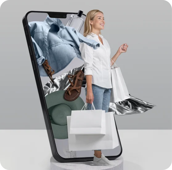 Happy woman stepping out of a smartphone, carrying shopping bags while wearing stylish clothes, surrounded by various fashion items like shirts and accessories.